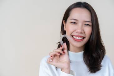 north york woman holding clear aligners
