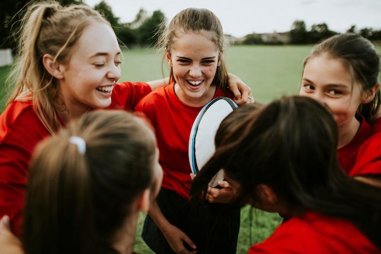 young girls playing rugby