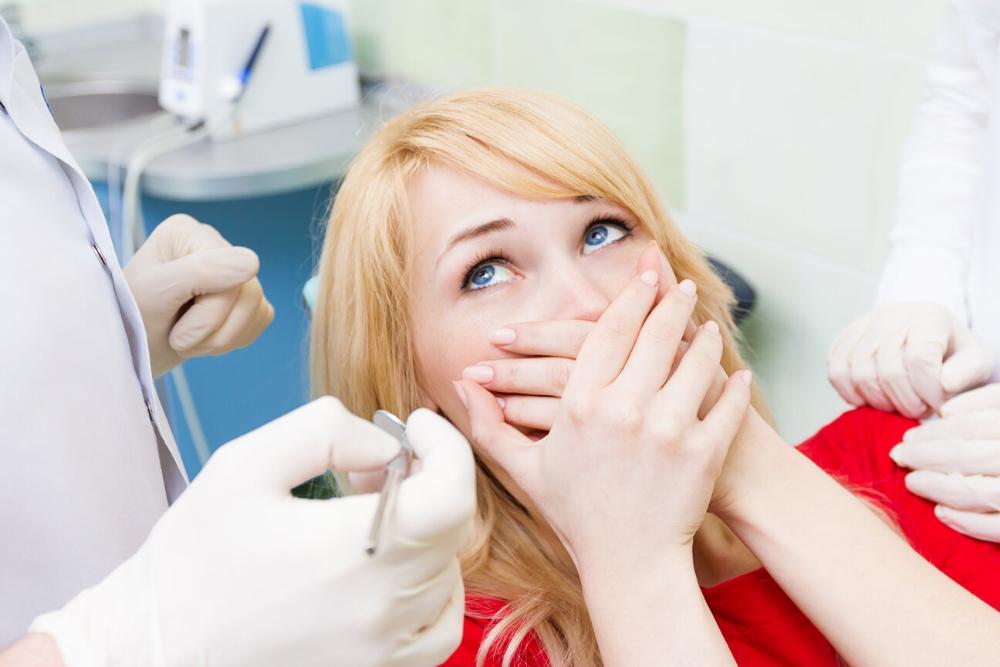 north york woman covering mouth from fear of dentist