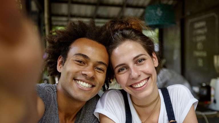 man and woman smiling while taking a selfie in north york