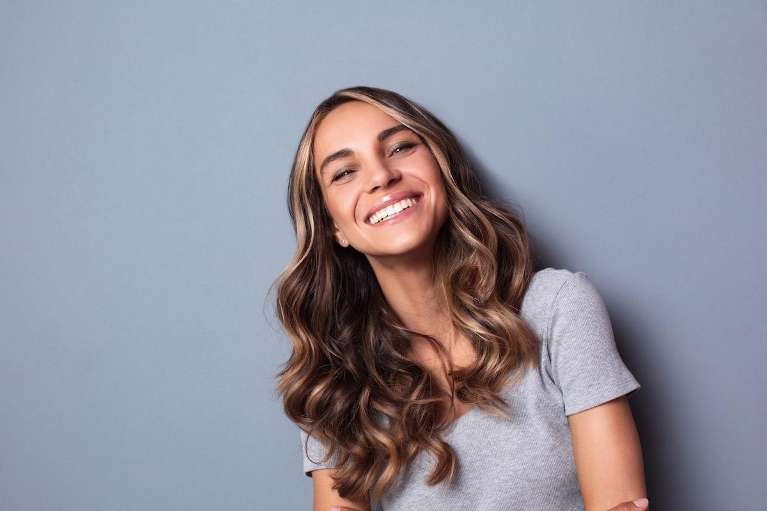 north york woman smiling after getting invisalign