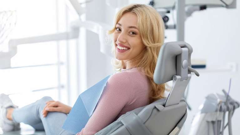 north york woman sitting in dental chair 