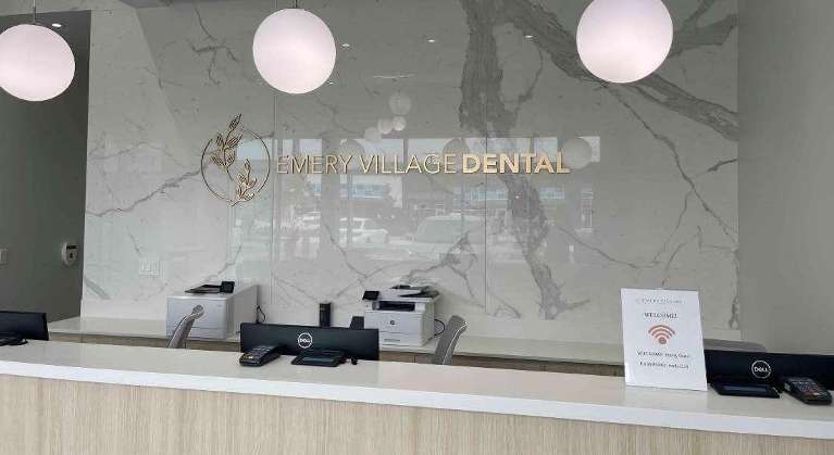 front desk and sign of Emery Village Dental