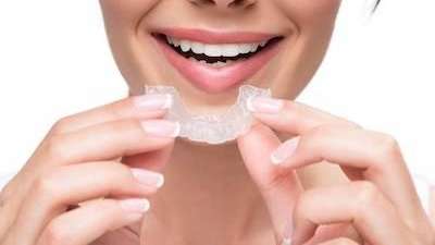 north york woman holding invisalign