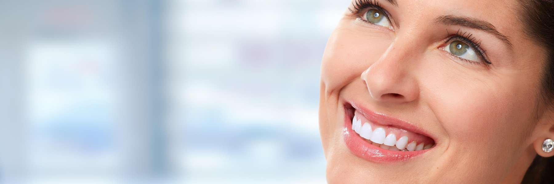 woman smiling after getting veneers
