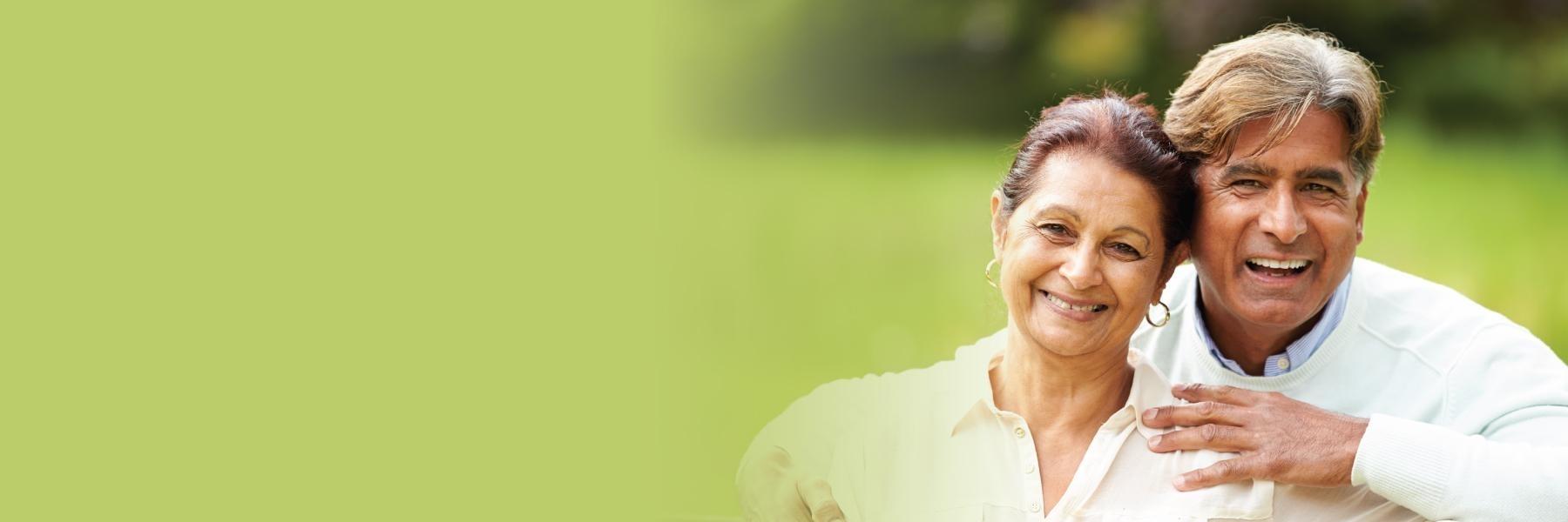 older man and woman smiling in a north york park