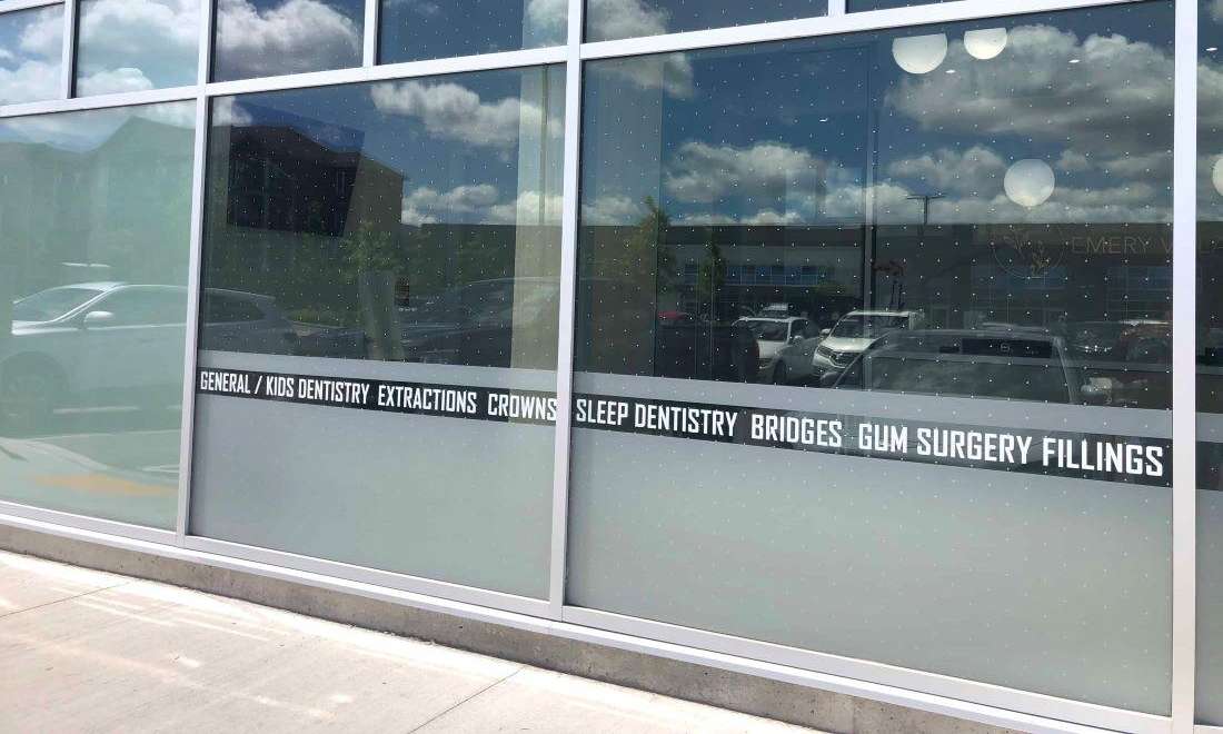 front window of emery village dental